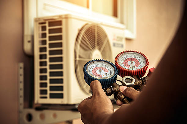 Professional Air Conditioning Service technician working in Wrens, GA